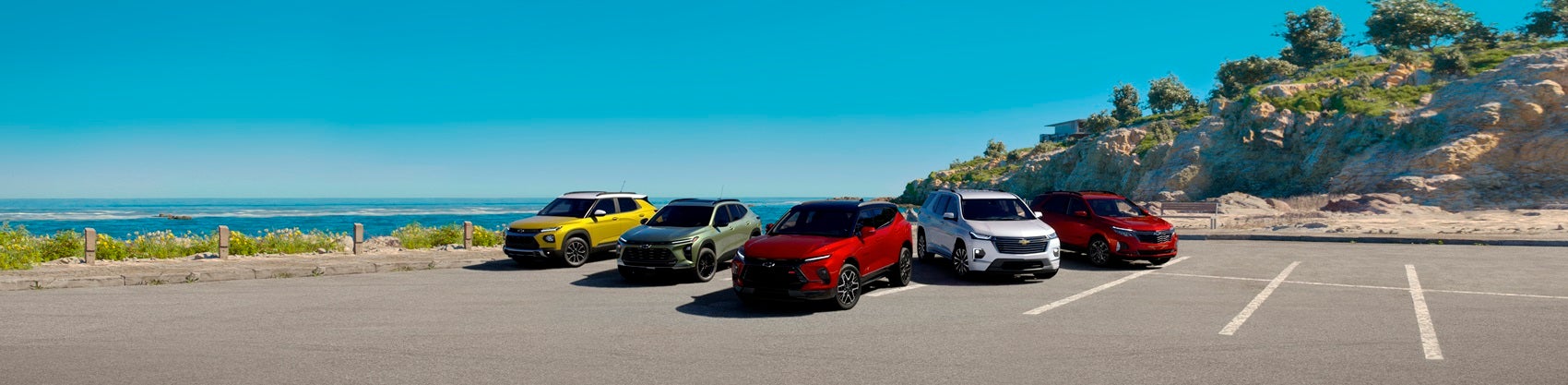 Chevrolet SUV model lineup in beachside parking lot