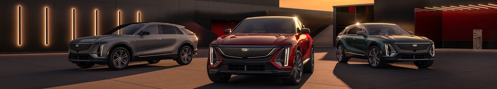 Cadillac model lineup in a driveway